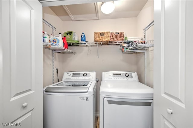 laundry room featuring washing machine and clothes dryer