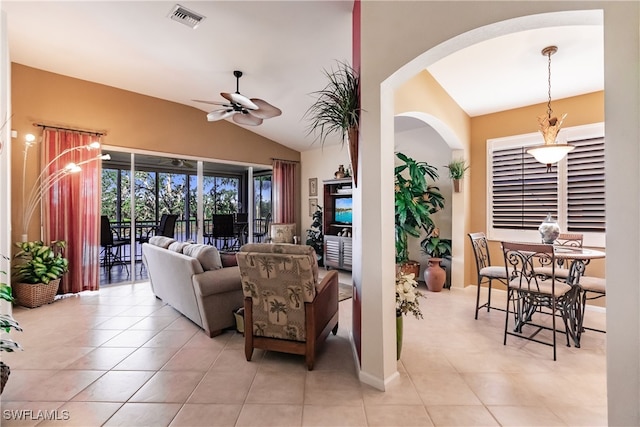 tiled living room featuring vaulted ceiling and ceiling fan