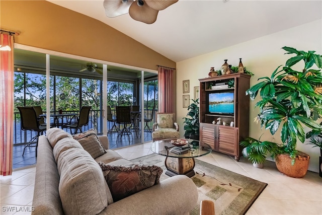 living room with light tile patterned flooring, vaulted ceiling, and ceiling fan