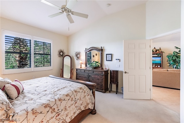 bedroom featuring vaulted ceiling, ceiling fan, and light colored carpet