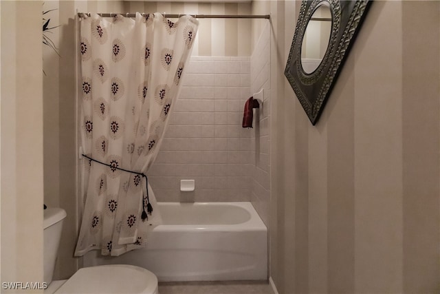 bathroom with shower / tub combo with curtain and toilet