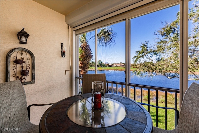 sunroom with a water view