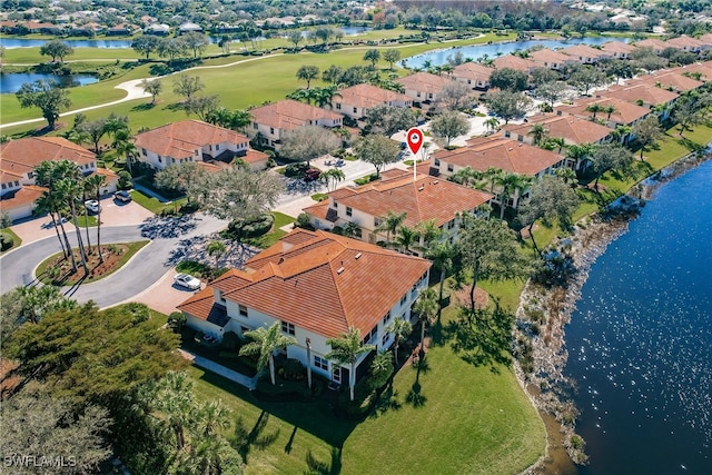 bird's eye view with a water view