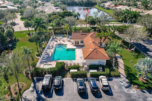 birds eye view of property with a water view