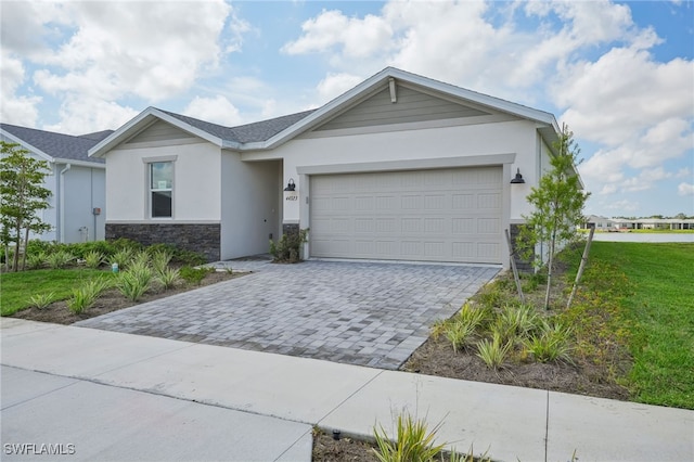 ranch-style house featuring a front yard and a garage