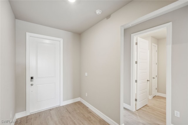 hallway with light wood-type flooring