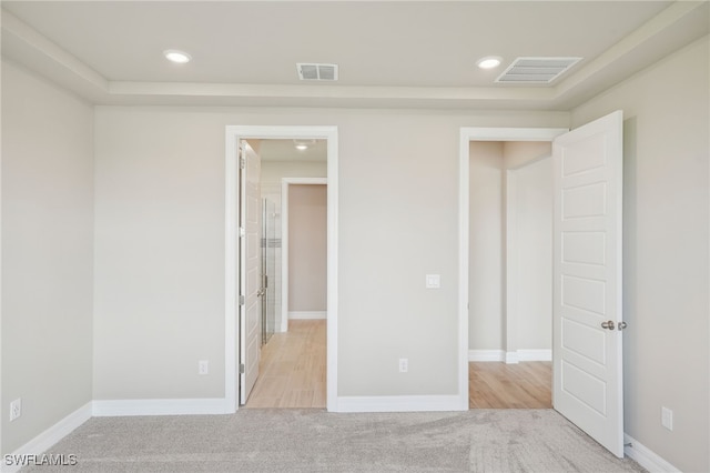 unfurnished bedroom with light carpet