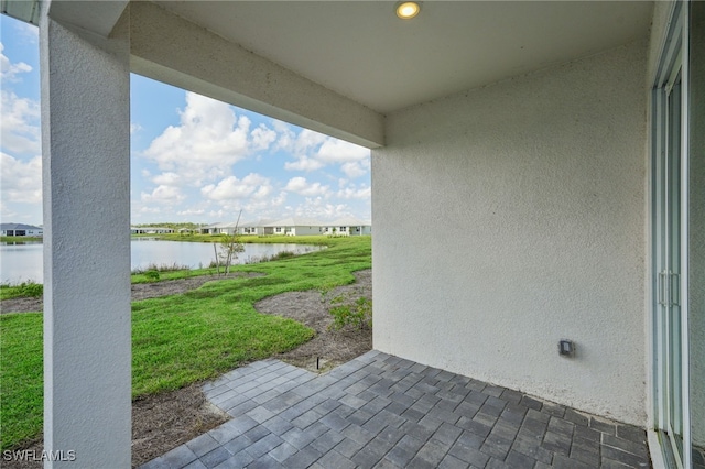 view of patio / terrace featuring a water view