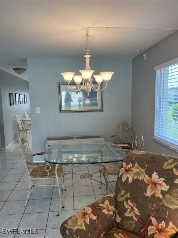 unfurnished dining area with a chandelier and light tile patterned floors