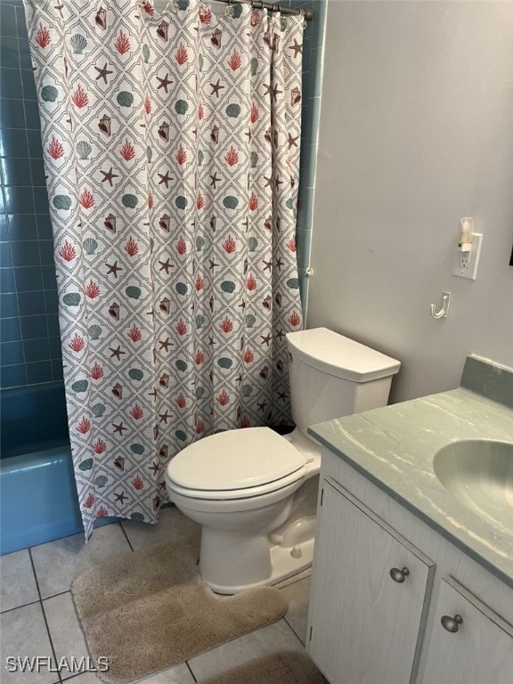 full bathroom featuring tile patterned flooring, vanity, toilet, and shower / tub combo with curtain