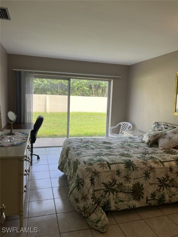 bedroom with light tile patterned floors