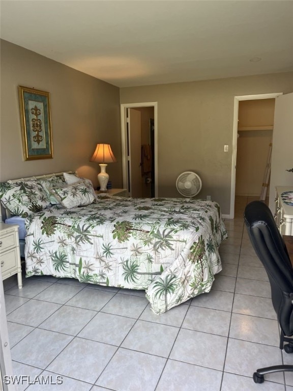 bedroom featuring light tile patterned floors