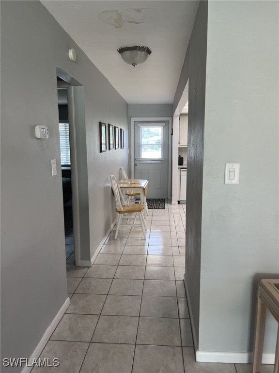 corridor with light tile patterned floors