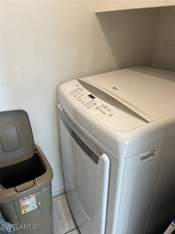 laundry room featuring light tile patterned flooring