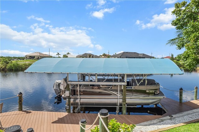 dock area featuring a water view and boat lift