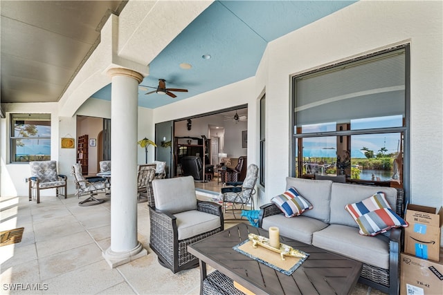 view of patio / terrace featuring ceiling fan, outdoor dining area, and an outdoor living space