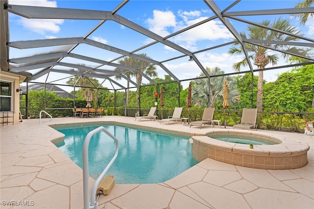 view of swimming pool featuring an in ground hot tub, pool water feature, a lanai, and a patio area