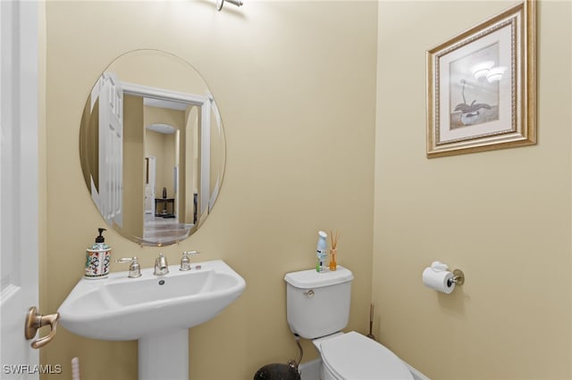 bathroom with sink and toilet