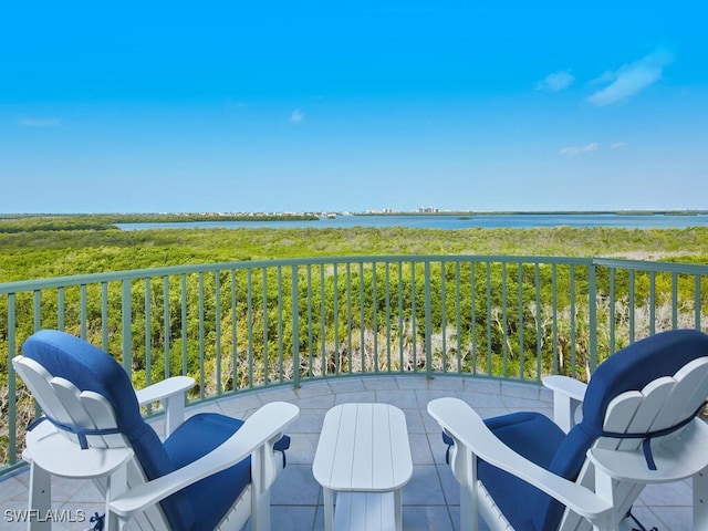 balcony featuring a water view