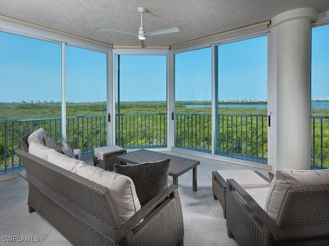 sunroom with ceiling fan and a healthy amount of sunlight