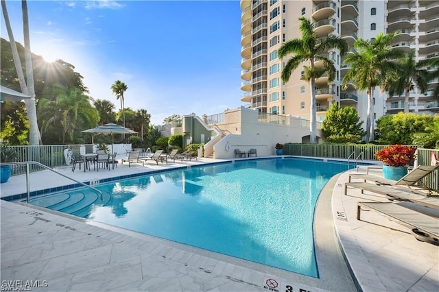 view of swimming pool with a patio area