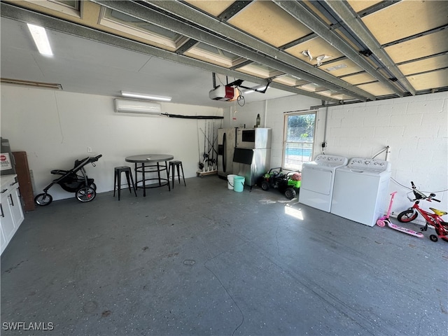 garage featuring a garage door opener and washer and dryer