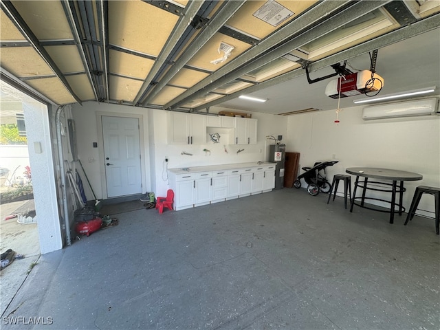 garage featuring a garage door opener and a wall mounted air conditioner