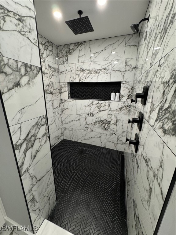 bathroom with a tile shower