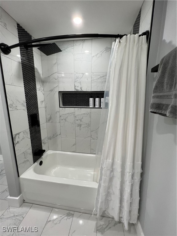 bathroom with shower / bath combo with shower curtain