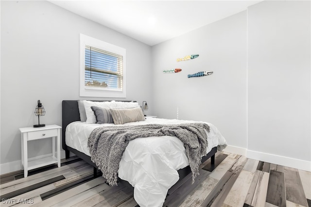 bedroom featuring wood-type flooring