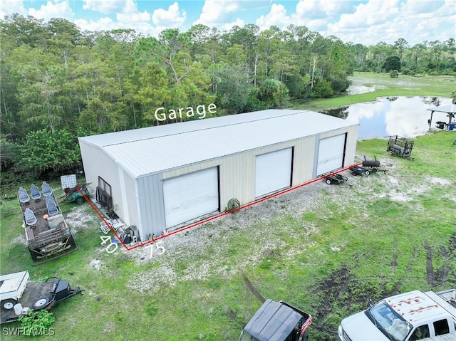 17800 Grand Chenier Rd, Fort Myers, FL 33913 - view of outdoor structure featuring a water view, an outbuilding, and a wooded view
