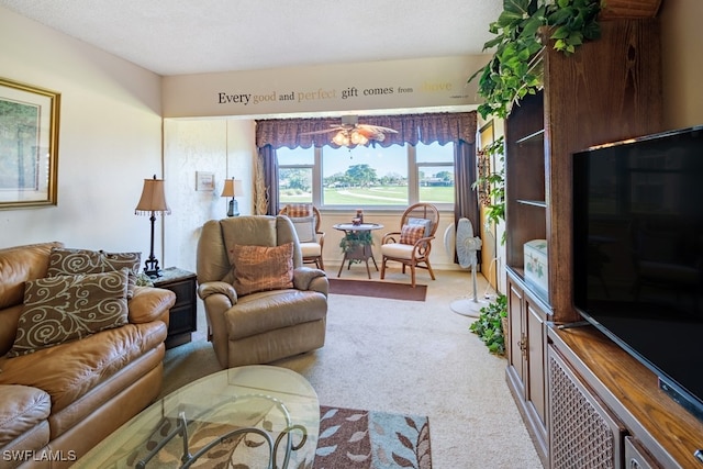 living room with carpet floors, a textured ceiling, and ceiling fan