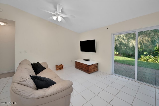 tiled living room with ceiling fan