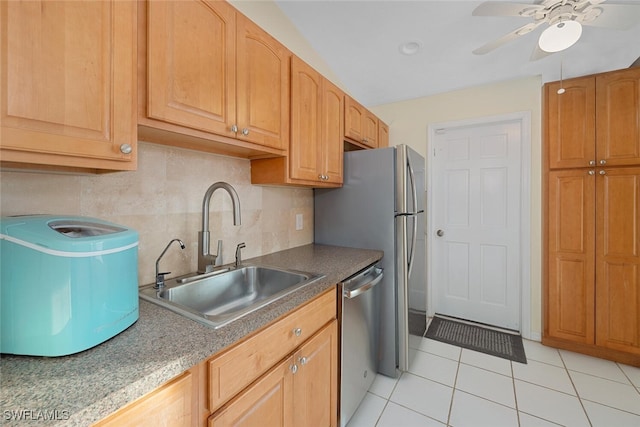 kitchen featuring dishwasher, sink, decorative backsplash, light tile patterned floors, and ceiling fan