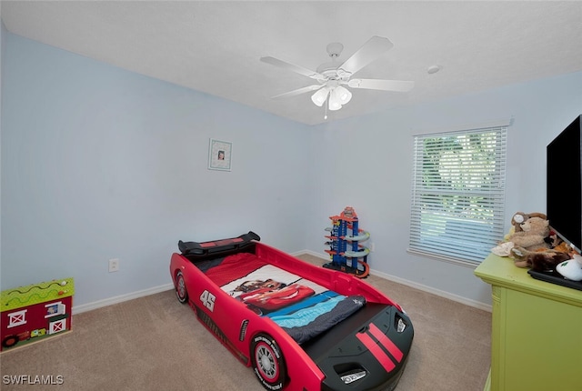 bedroom with light carpet and ceiling fan