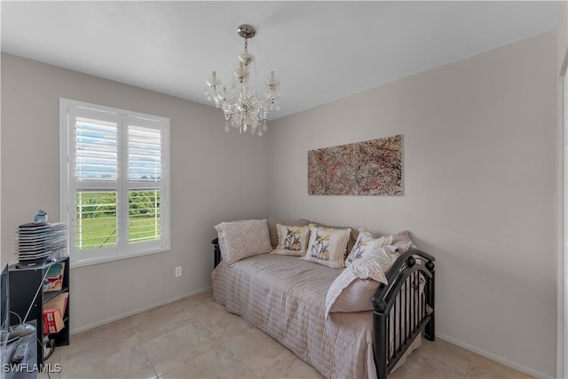 bedroom with a notable chandelier