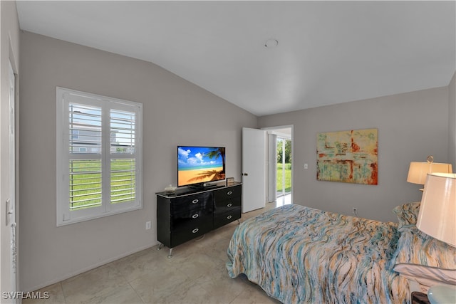 bedroom with lofted ceiling