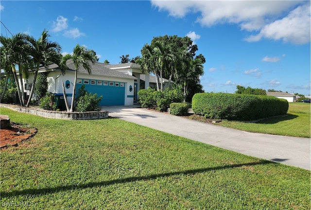 single story home featuring a garage and a front lawn