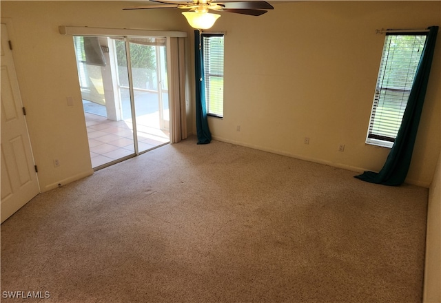 carpeted empty room with ceiling fan