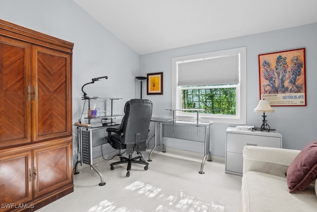 office area featuring vaulted ceiling