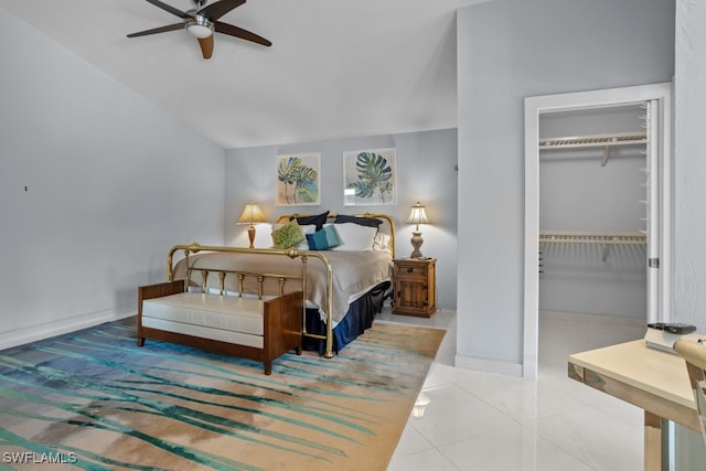 bedroom featuring ceiling fan, light tile patterned flooring, and lofted ceiling