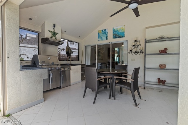 dining room with ceiling fan and lofted ceiling