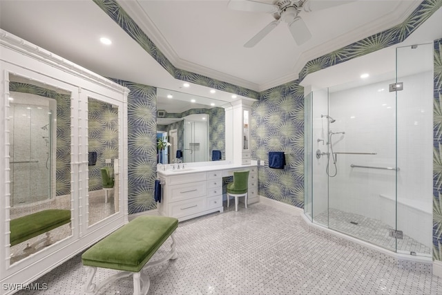 bathroom with vanity, walk in shower, ornamental molding, and ceiling fan