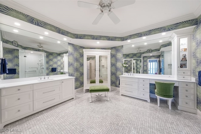 bathroom featuring vanity, walk in shower, crown molding, and ceiling fan