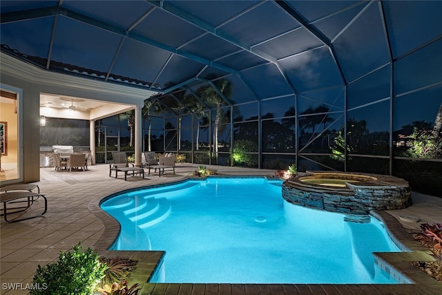 view of pool with a patio, a lanai, and an in ground hot tub