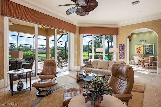 sunroom / solarium featuring ceiling fan and plenty of natural light