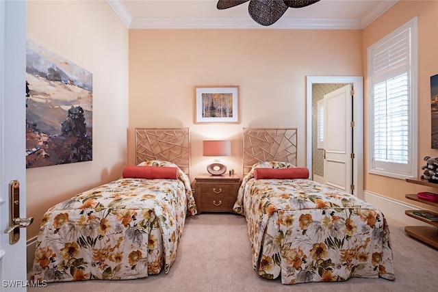 bedroom featuring light colored carpet, ceiling fan, and crown molding