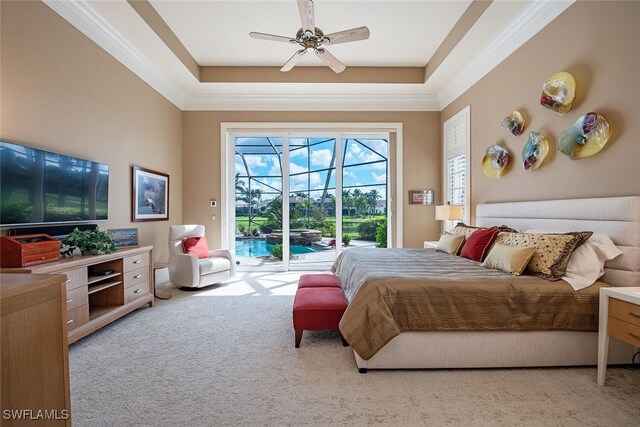 bedroom featuring access to outside, light colored carpet, ceiling fan, and a raised ceiling