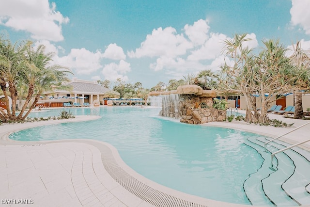 view of swimming pool featuring pool water feature