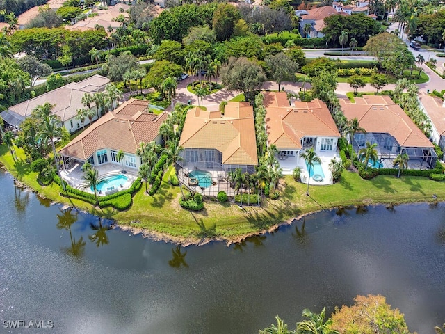 birds eye view of property featuring a water view